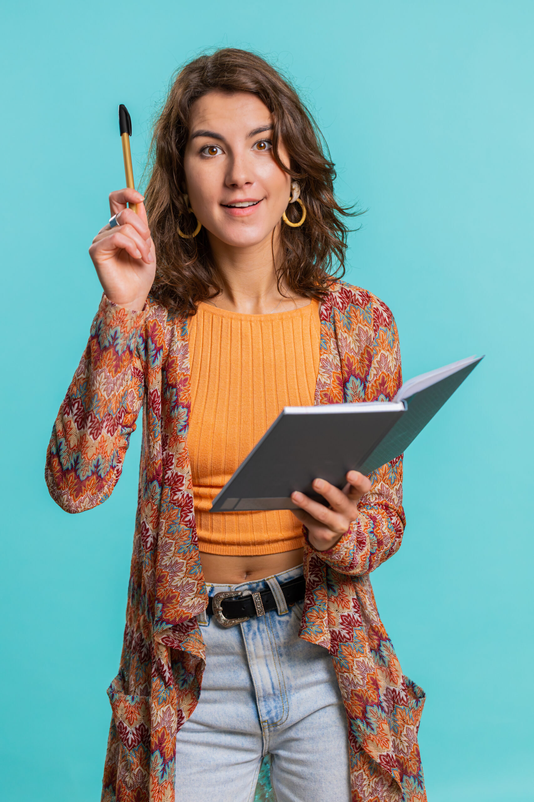 woman making notes writing down thoughts with pen into notepad notebook diary, to do list, good idea