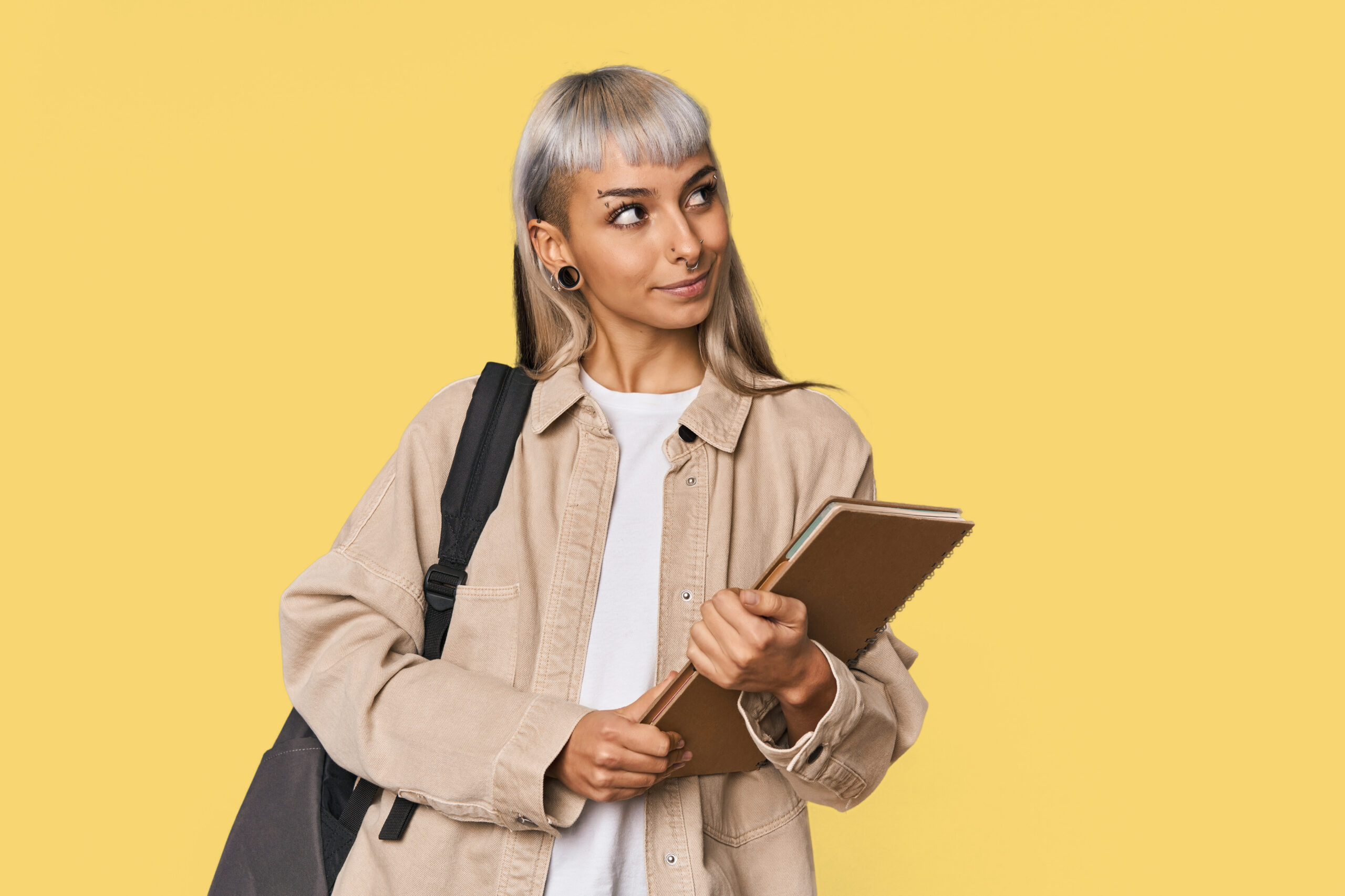 young caucasian student with a notebook